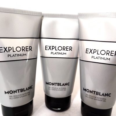 Three silver tubes of Montblanc Explorer Platinum all-over shower gel stand side by side against a white background.