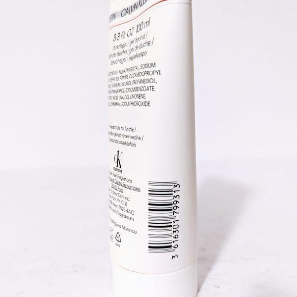White cosmetic bottle with text and barcode on the back label, standing upright on a white surface.