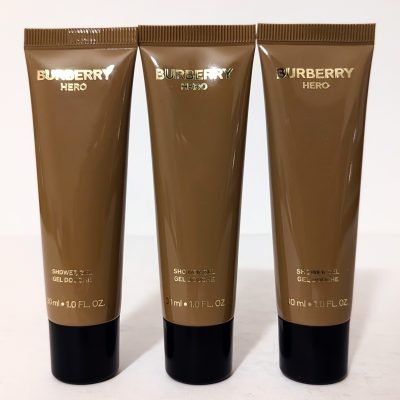 Three brown tubes of Burberry Hero shower gel, each containing 30 ml (1.0 FL OZ), arranged upright in a row against a plain background.