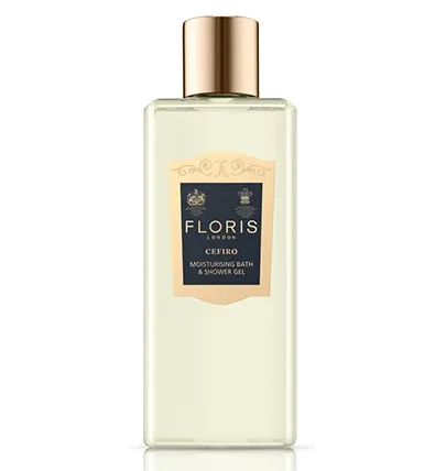 A clear bottle of Floris London Cefiro Moisturising Bath & Shower Gel 250ml, adorned with a gold cap and label featuring text and decorative elements.