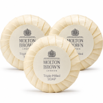 Three 3x Molton Brown Triple-Milled Milk Soap 25g Minatures, round bars wrapped in cream paper with white labels displaying the brand logo and name.