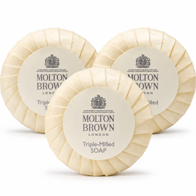 Three 3x Molton Brown Triple-Milled Milk Soap 25g Minatures, round bars wrapped in cream paper with white labels displaying the brand logo and name.