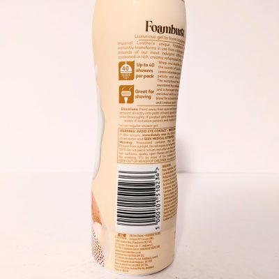 Back of a foam body wash bottle showing usage instructions, product features, a barcode, and cautionary information on the label.