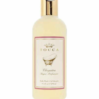 A 270 ml bottle of Tocca Cleopatra Body Wash Shower Gel for Women, featuring a gold cap and an illustrated vintage bathtub on the label.