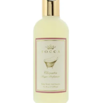 A set of two Tocca Cleopatra Body Wash 270ml bottles for women, each with a gold cap and cream-colored label featuring a bathtub illustration.