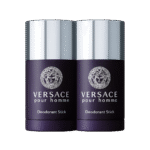 Two Versace New Homme Deodorant Sticks (75ml each) with dark purple bodies and silver caps are placed side by side against a plain white background.