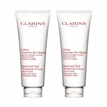 Two 100ml tubes of 2x Clarins Skincare Hand & Nail Treatment Cream are displayed side by side, featuring product details in French and English on white packaging.
