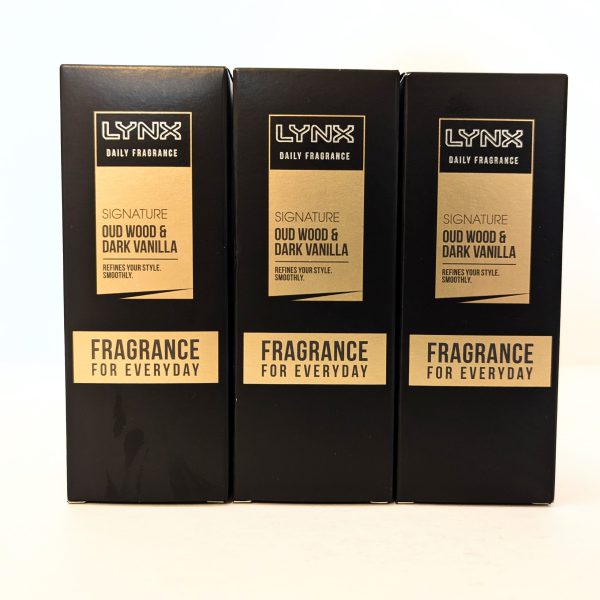 Three black boxes of Lynx Daily Fragrance, Signature Oud Wood & Dark Vanilla scent, are displayed side by side with "Fragrance for Everyday" written on the front.