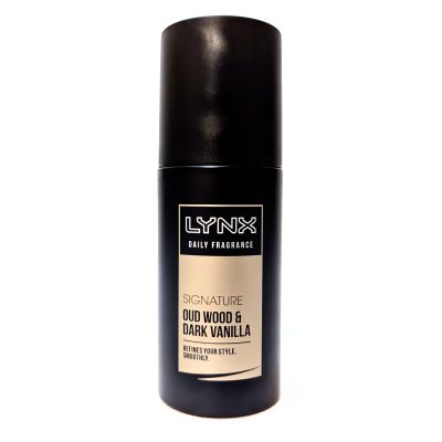 A black cylindrical can of Lynx Daily Fragrance Signature Oud Wood & Dark Vanilla against a white background.