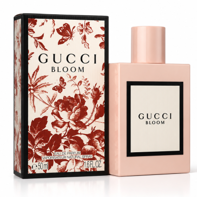 A Gucci Bloom Intense Eau de Parfum 50ml Spray for Her bottle stands next to its floral-patterned box, both featuring the brand logo and product name.