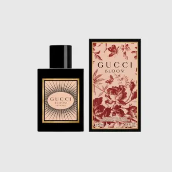 A bottle of Gucci Bloom Intense Eau de Parfum 50ml Spray for Her is displayed beside its floral-patterned box, both featuring the product name and size.