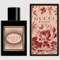 A bottle of Gucci Bloom Intense Eau de Parfum 50ml Spray for Her is displayed beside its floral-patterned box, both featuring the product name and size.