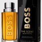 A bottle of Hugo Boss The Scent EDT for Men, 100ml, is displayed beside its black and gold packaging, highlighting it as a refillable spray.
