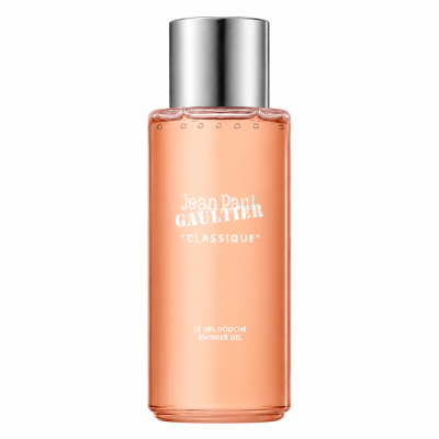 A transparent bottle with a silver cap, labeled “Jean Paul Gaultier Classique Bath & Shower Gel, 200ml,” contains peach-colored gel.