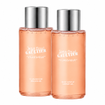 Two identical bottles of Jean Paul Gaultier Classique Bath & Shower Gel, 200ml, with silver caps and peach-colored liquid, are standing side by side against a white background.