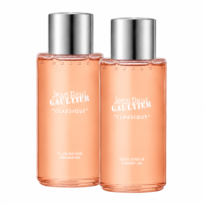 Two identical bottles of Jean Paul Gaultier Classique Bath & Shower Gel, 200ml, with silver caps and peach-colored liquid, are standing side by side against a white background.