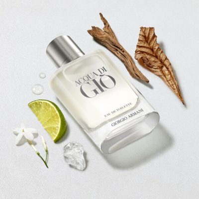 A 200ml bottle of Giorgio Armani Acqua Di Gio EDT Spray for men is pictured with a lime wedge, white flower, ice cube, water droplets, a dried brown leaf, and a piece of wood.