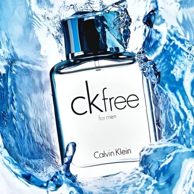 A bottle of Calvin Klein CK Free EDT 100ml Spray for Men is surrounded by splashing blue water.