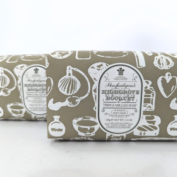 Two bars of Penhaligon's Highgrove Bouquet triple milled soap with cream-colored packaging featuring white kitchen utensil illustrations. Two bars of Penhaligon's Highgrove Bouquet triple milled soap with cream-colored packaging featuring white kitchen utensil illustrations.