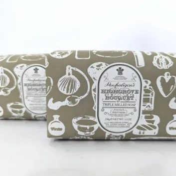 Two bars of Penhaligon's Highgrove Bouquet triple milled soap with cream-colored packaging featuring white kitchen utensil illustrations.