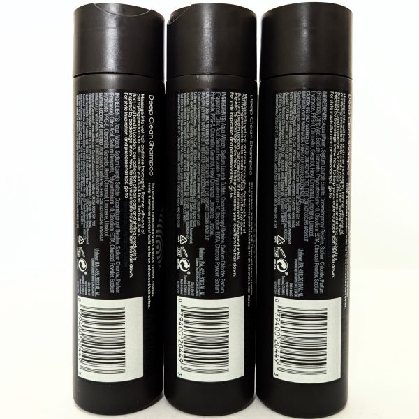 Three black shampoo bottles are shown standing upright side by side, displaying product information and barcodes on their back labels.