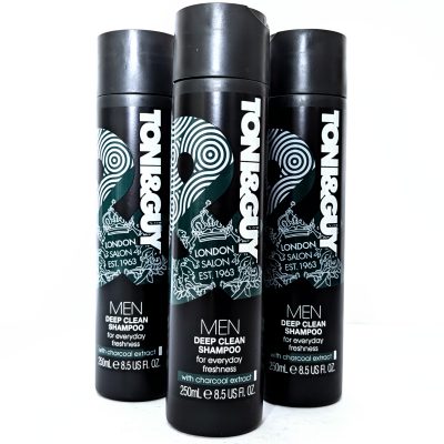 Three black bottles of Toni & Guy Men Deep Clean Shampoo with charcoal extract, each 250 mL, are standing upright side by side against a white background.