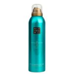 A teal can of Rituals The Ritual of Karma Foaming Shower Gel 200ml features a gold dispenser, clear cap, and is scented with holy lotus and white tea.