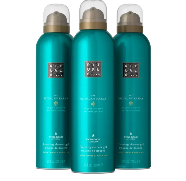 Three teal bottles of Rituals The Ritual of Karma Foaming Shower Gel 200ml are placed side by side against a plain black background.