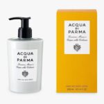 Set of 2 Acqua di Parma Colonia Hand and Body Lotion, 300ml each, unisex. Each bottle is white with a black pump; packaging includes a yellow box with black text.