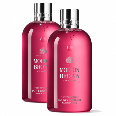 Two bottles of Molton Brown Fiery Pink Pepper Bath & Shower Gel 300ml (unisex), each featuring a silver cap and vibrant pink liquid, are displayed against a white background.