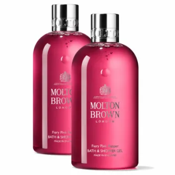 Two bottles of Molton Brown Fiery Pink Pepper Bath & Shower Gel 300ml (unisex), each featuring a silver cap and vibrant pink liquid, are displayed against a white background.