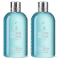 Two bottles of Molton Brown Coastal Cypress & Sea Fennel Bath and Shower Gel (300ml, unisex) with silver caps, clear blue liquid, and white labels stand side by side against a white background.