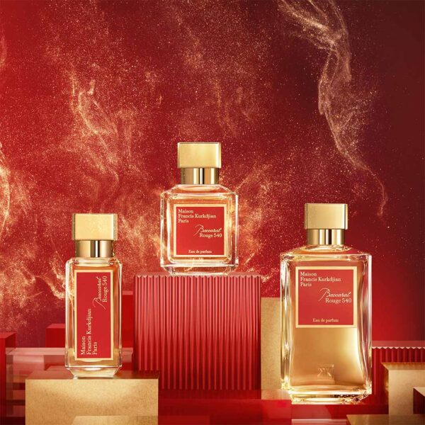 Three bottles of Maison Francis Kurkdjian Baccarat Rouge 540 EDP 200ml Spray, Unisex, are displayed on red platforms against a fiery, swirling backdrop.