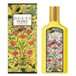 A yellow Gucci Flora Gorgeous Orchid EDP 100ml bottle and its matching floral-patterned box are displayed side by side.