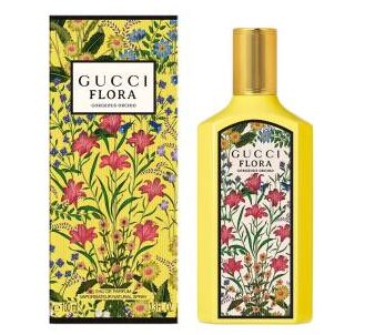 A yellow Gucci Flora Gorgeous Orchid EDP 100ml bottle and its matching floral-patterned box are displayed side by side.