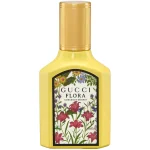 A yellow bottle of Gucci Flora Gorgeous Orchid EDP 30ml Spray for women, featuring a floral label with pink and purple flowers and green leaves.
