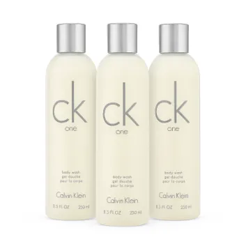 Three bottles of CK One Shower Gel Body Wash 250ml, unisex, with silver caps, are lined up side by side against a white background.