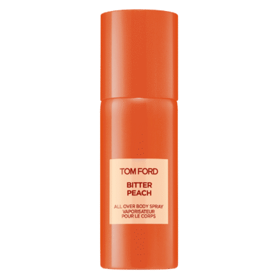 Two orange spray bottles labeled "Tom Ford Bitter Peach All Over Body Spray" stand upright against a plain white background.