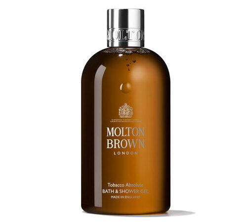 A bottle of Molton Brown London Tobacco Absolute Bath & Shower Gel with a brown body and silver cap, shown against a white background. A bottle of Molton Brown London Tobacco Absolute Bath & Shower Gel with a brown body and silver cap, shown against a white background.