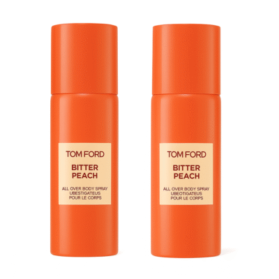 Two upright orange spray bottles of 2x Tom Ford Bitter Peach All Over Body Spray on a white background.