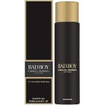 Three black and gold cans of Carolina Herrera Bad Boy Deodorant Spray for Men, 100ml each, stand next to their matching boxes.