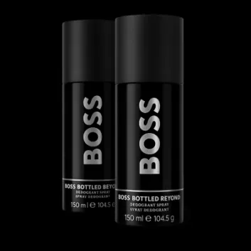 Three black cans of Hugo Boss Bottled Beyond Deodorant Spray for men (150 ml each) are arranged side by side against a plain background.