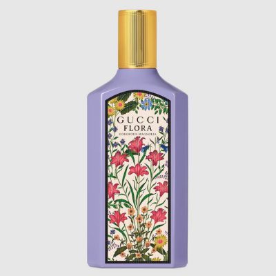 A 100ml purple bottle of Gucci Flora Gorgeous Magnolia Eau de Parfum for Women features a gold cap and a floral label on the front.