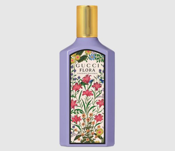 A 100ml purple bottle of Gucci Flora Gorgeous Magnolia Eau de Parfum for Women features a gold cap and a floral label on the front.
