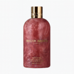 Two bottles of Molton Brown Rose Dunes Bath & Shower Gel 300ml for unisex use, each featuring a marbled pink design with a gold cap and "Made in England" label.