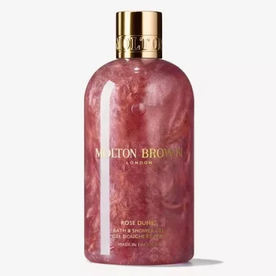 Two 300ml bottles of Molton Brown Rose Dunes Bath & Shower Gel for unisex, each in a pink marbled bottle with a gold cap, displayed against a white background.