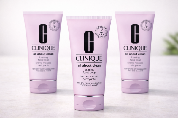 Three pink 150ml tubes of 3x Clinique Foaming Sonic Facial Soap are displayed upright on a light surface.