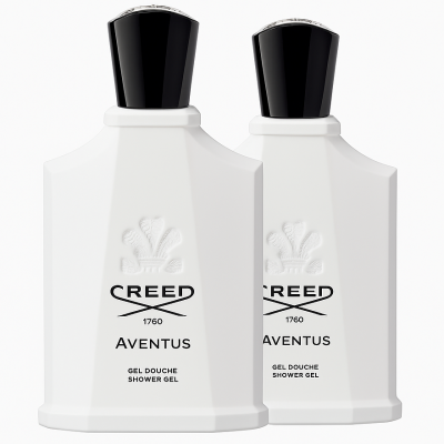Two white bottles of Creed Aventus for Her Shower Gel 200ml with black caps are placed side by side, displaying the embossed logo and product details on the front.