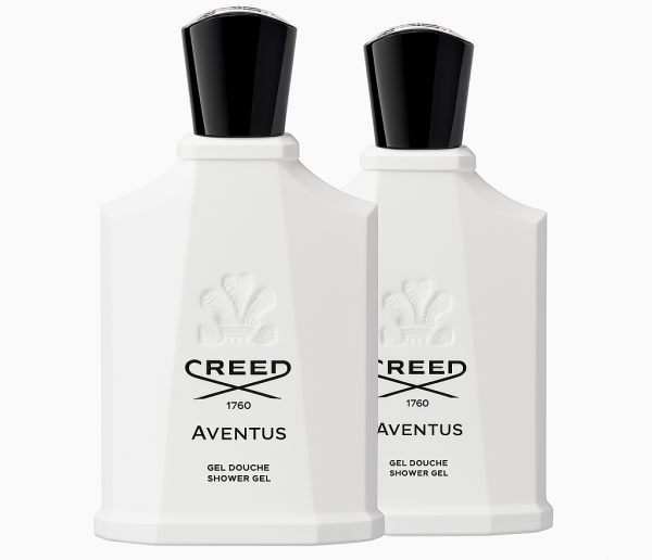 Two white bottles of Creed Aventus for Her Shower Gel 200ml with black caps are placed side by side, displaying the embossed logo and product details on the front.