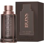 A 50ml bottle and box of Hugo Boss Boss The Scent Le Parfum Spray for Him, with a brown and rose gold design.